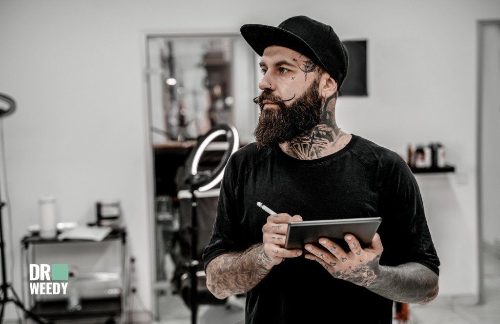 Tattoo artist consulting with a client, emphasizing the importance of communication and understanding