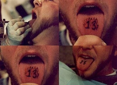 A simple heart tattoo on the tip of a tongue