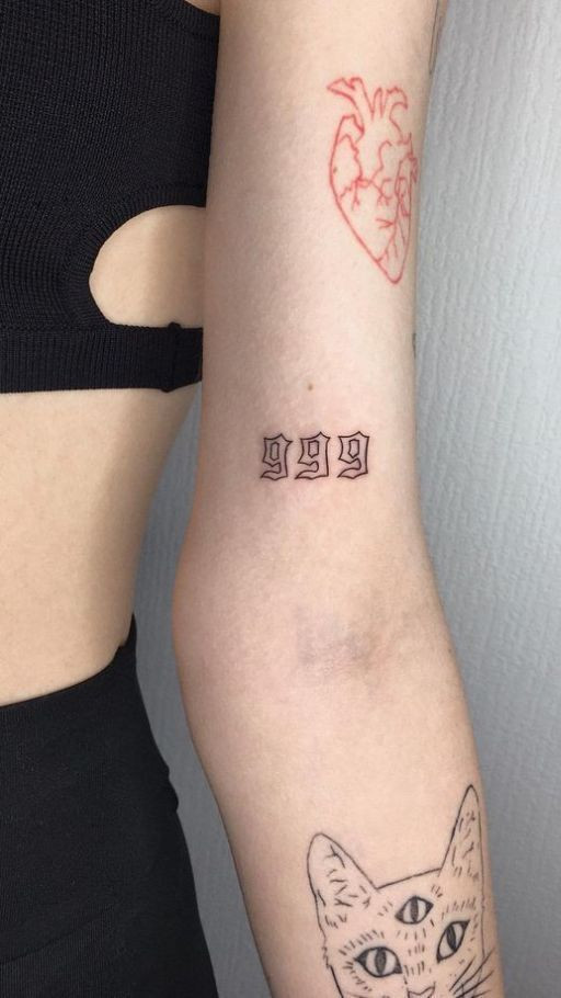 Thigh Tattoo Ideas 999 tattoo meaning of abstract three nines above the elbow