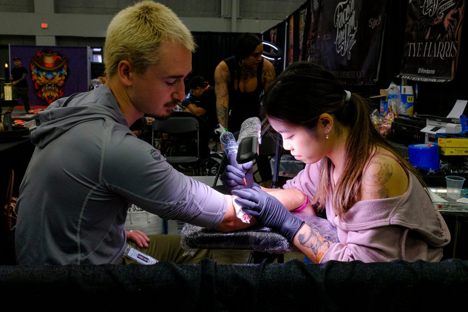 Ella Emhoff displaying her tattoos, showcasing modern body art