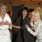 Dolly appears to have a butterfly tattoo peeking through the sleeve of her shirt