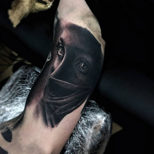 abstract woman inner bicep tattoo for men, easily hidden for personal reasons