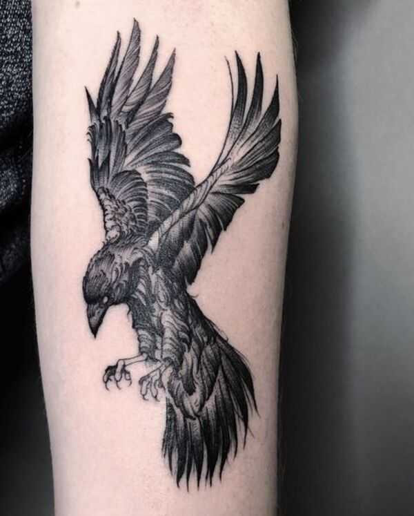 An aesthetically pleasing crow tattoo design featuring elegant linework and a minimalist style