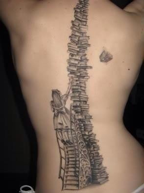 Girl and book tattoo on back