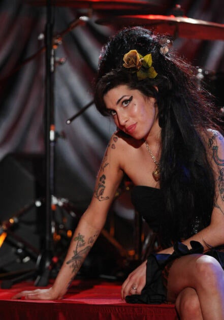 Amy Winehouse, despite having tattoos, was buried in a Jewish cemetery. (Wikimedia Commons)
