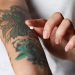 Applying tattoo removal cream