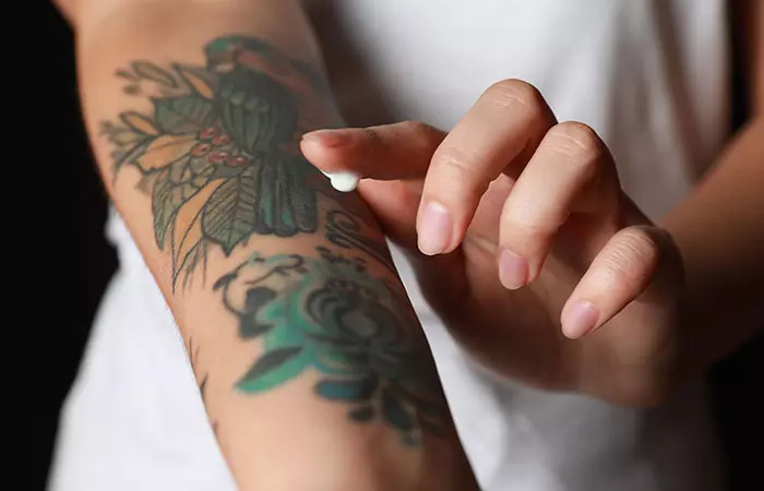 Applying tattoo removal cream