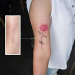 Floral tattoo covering a scar