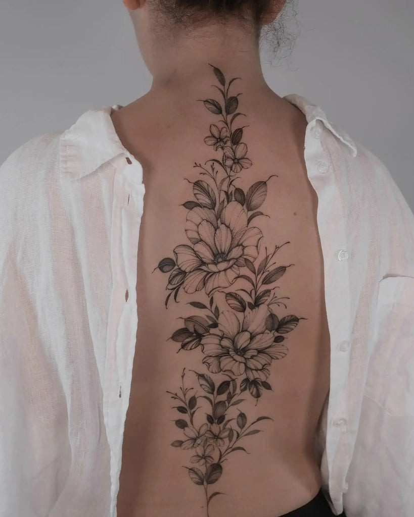 Back tattoo showing a graceful mermaid, symbolizing mystery and allure