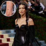 Bella Hadid's rose tattoo on her left arm, a delicate floral design showcasing her minimalist tattoo aesthetic