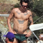 Harry Styles was seen with a thigh tattoo that seemingly references his ex-girlfriend Olivia Wilde. COBRA TEAM / BACKGRID