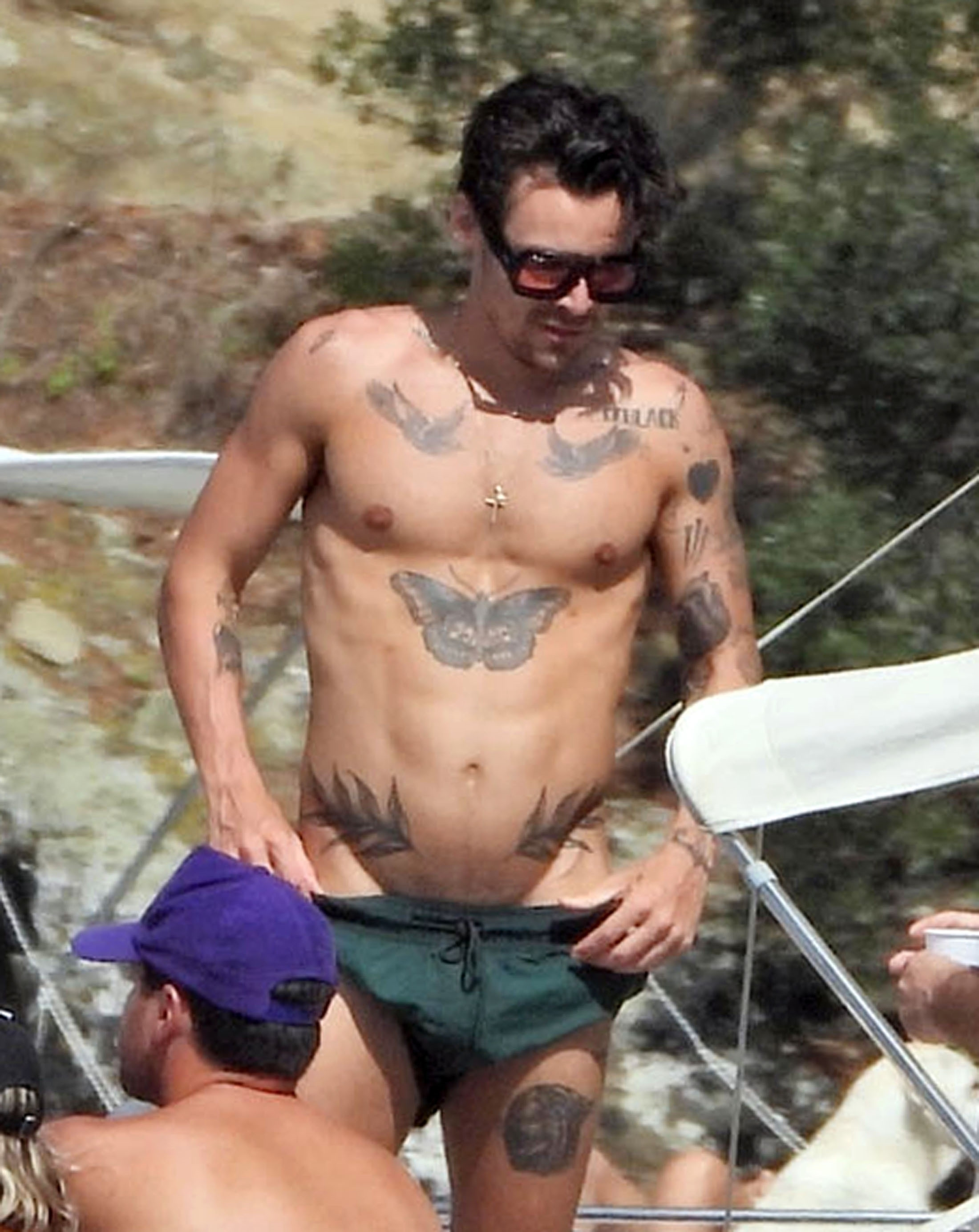 Harry Styles was seen with a thigh tattoo that seemingly references his ex-girlfriend Olivia Wilde. COBRA TEAM / BACKGRID