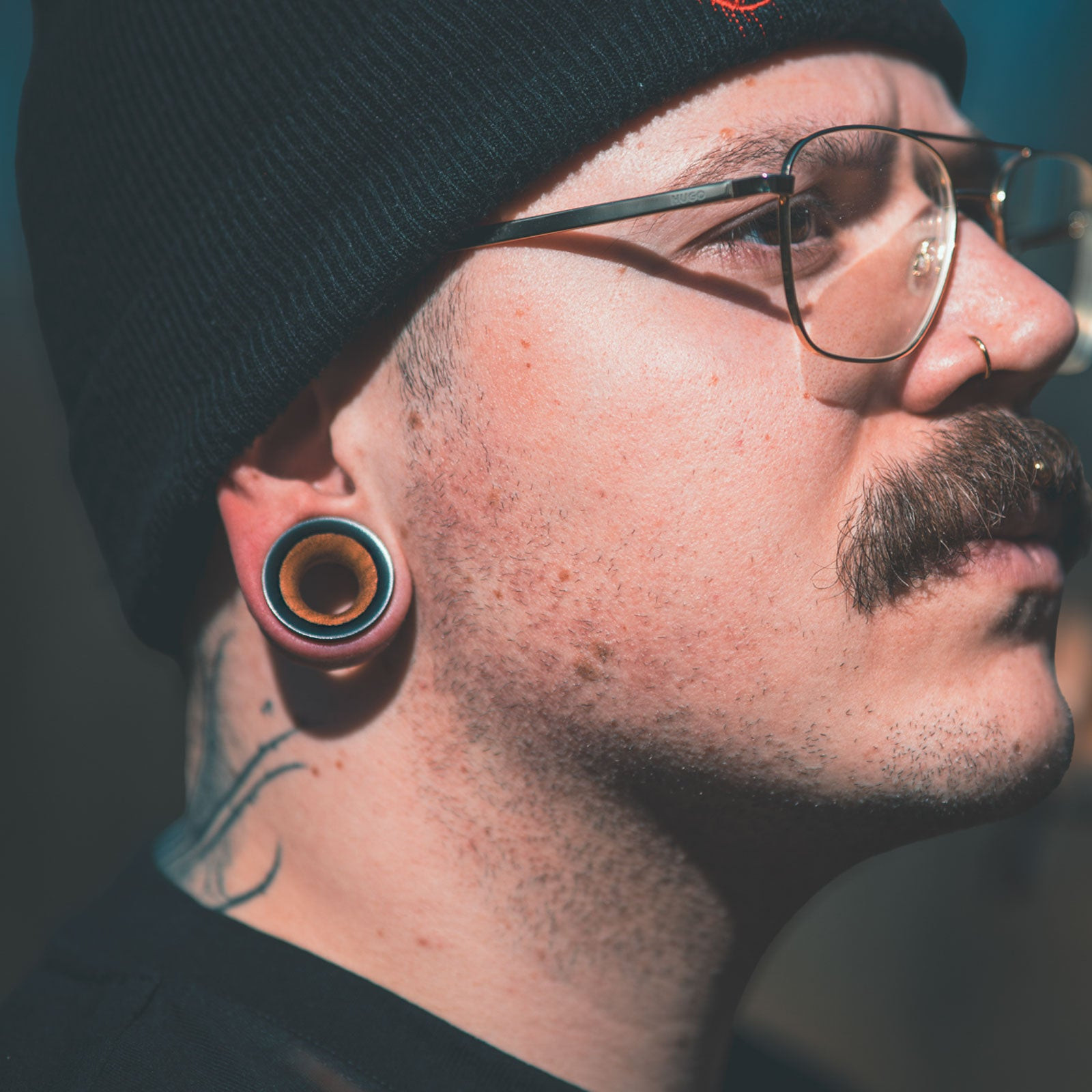 Model With Stretched Lobes Wearing Wood Tunnel