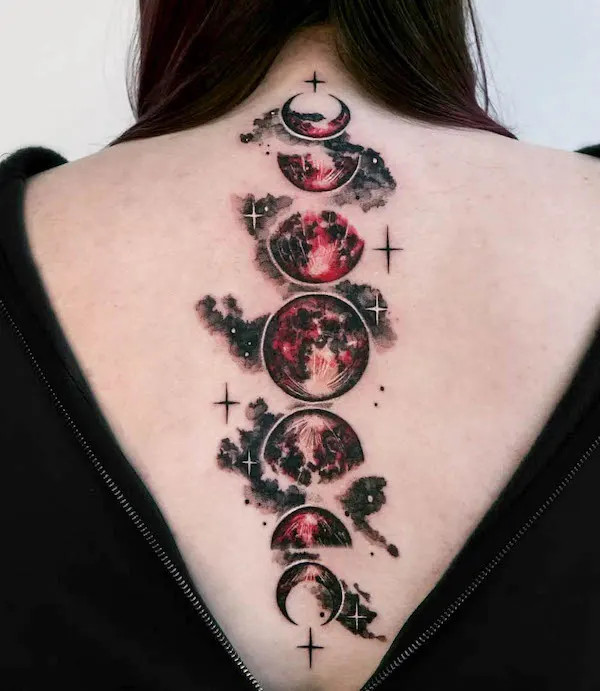 Artistic spine tattoo of a blood moon, designed by @tattooist_danha