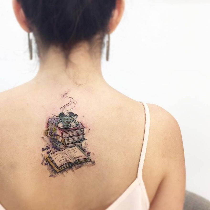 Book pile tattoo with tea cup