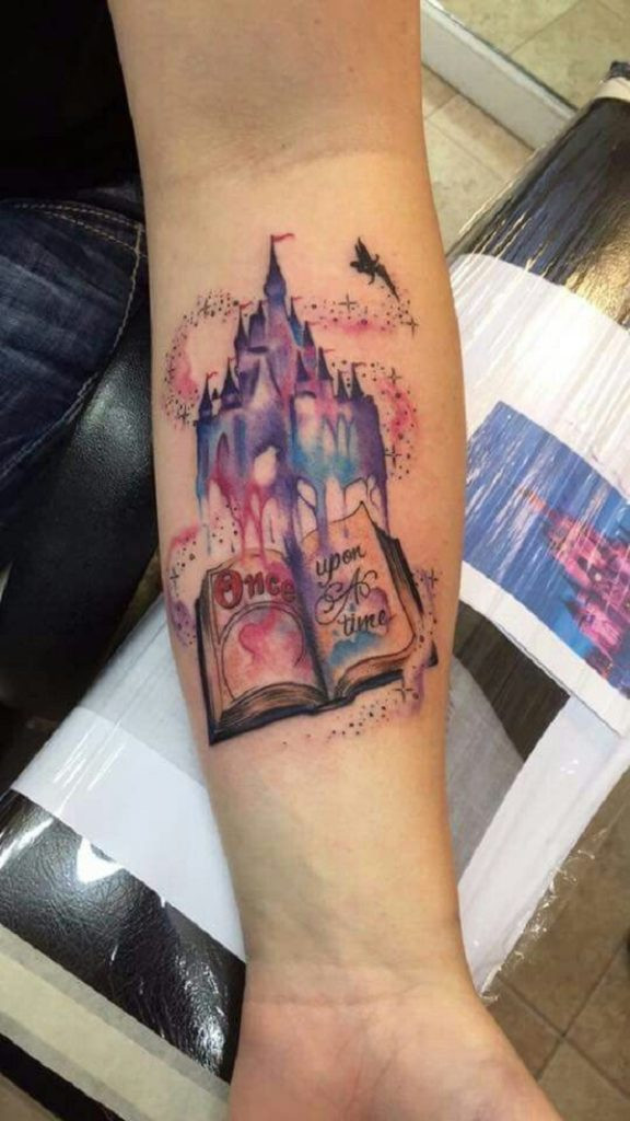 Colorful watercolor book tattoo