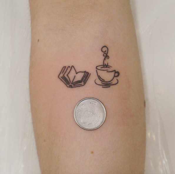 Book tattoo design on fingers