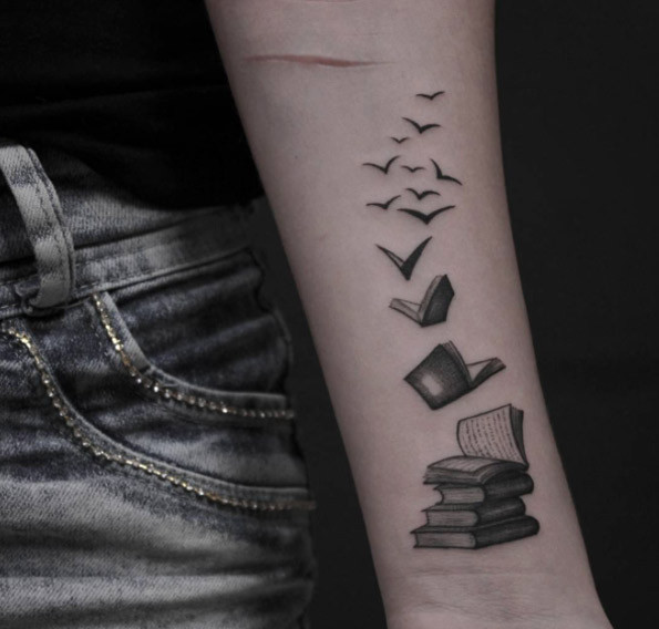 Book and bird tattoo design
