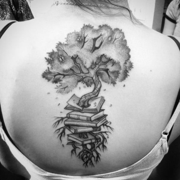 Book turning into a tree tattoo