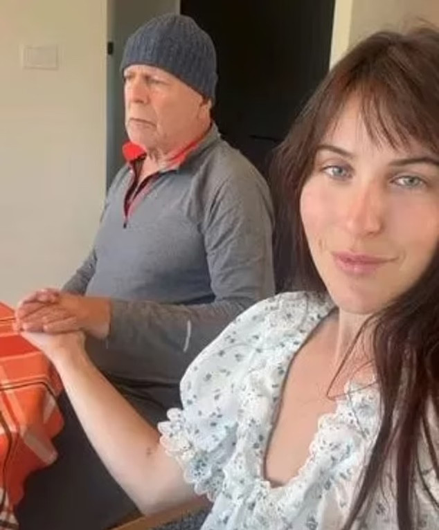 Bruce Willis gently holds onto