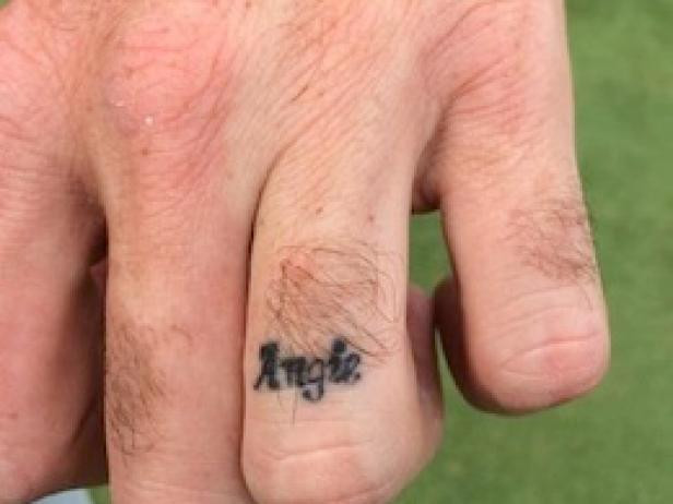 Bubba Watson's simple yet meaningful tattoo of his wife's name, "Angie," on his left ring finger, celebrated their tenth wedding anniversary with a permanent symbol of love and commitment