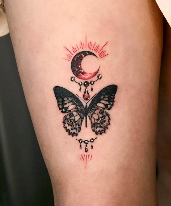 Butterfly front thigh tattoo for women
