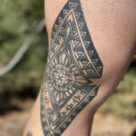 Tattoo depicting a caduceus with intertwined snakes, symbolizing medicine and healing, ideal for a physical therapist