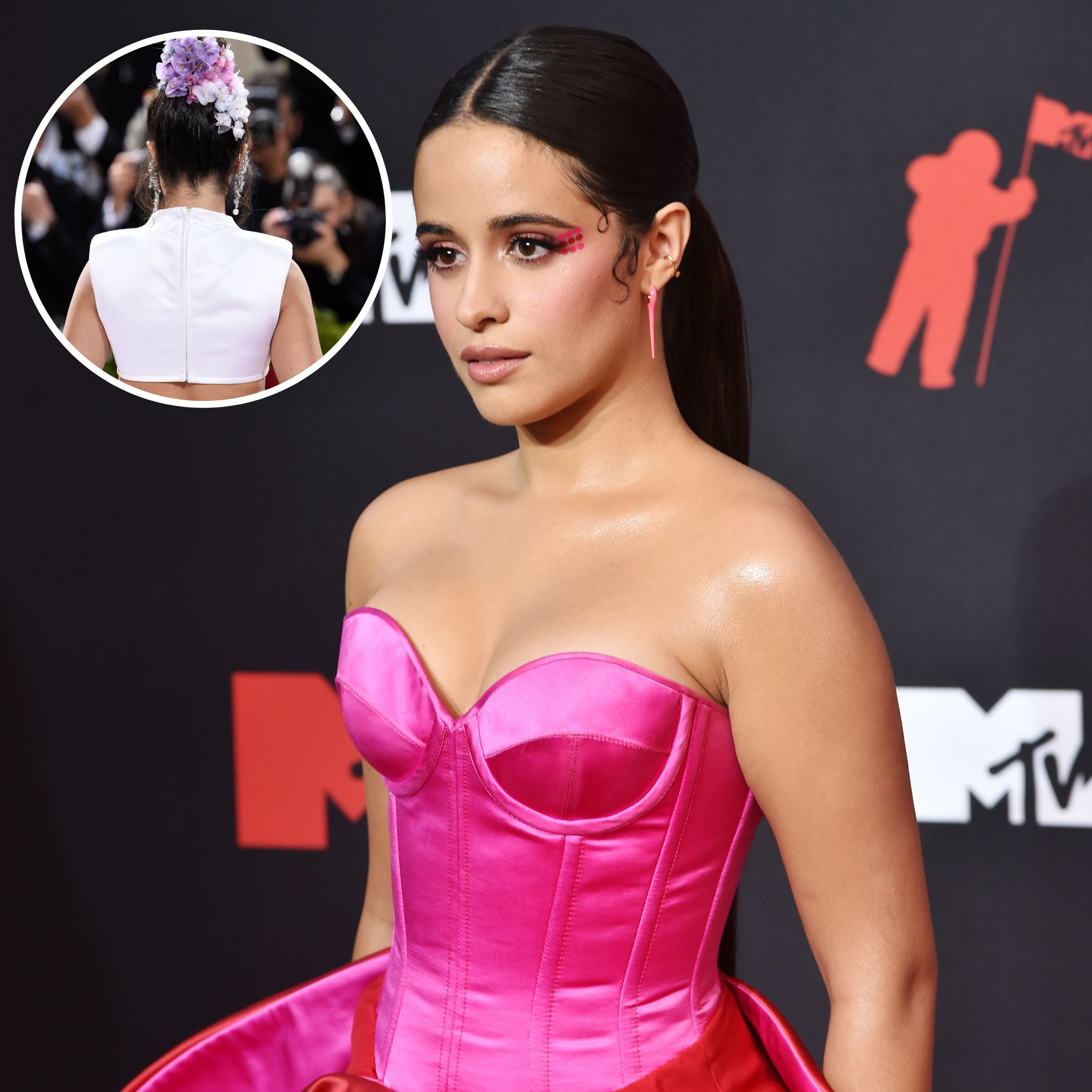 Camila Cabello showcasing her braided sweetgrass tattoo on the back of her neck, symbolizing her appreciation for indigenous wisdom and nature's gifts