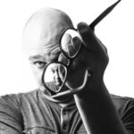 Actor applying makeup to cover a tattoo