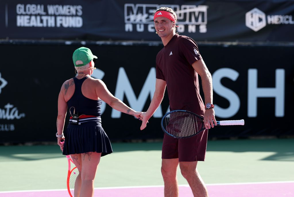 Pink with Alexander Zverev, showcasing her arm tattoos at the event