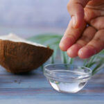 Applying Coconut Oil to Tattoo for Aftercare