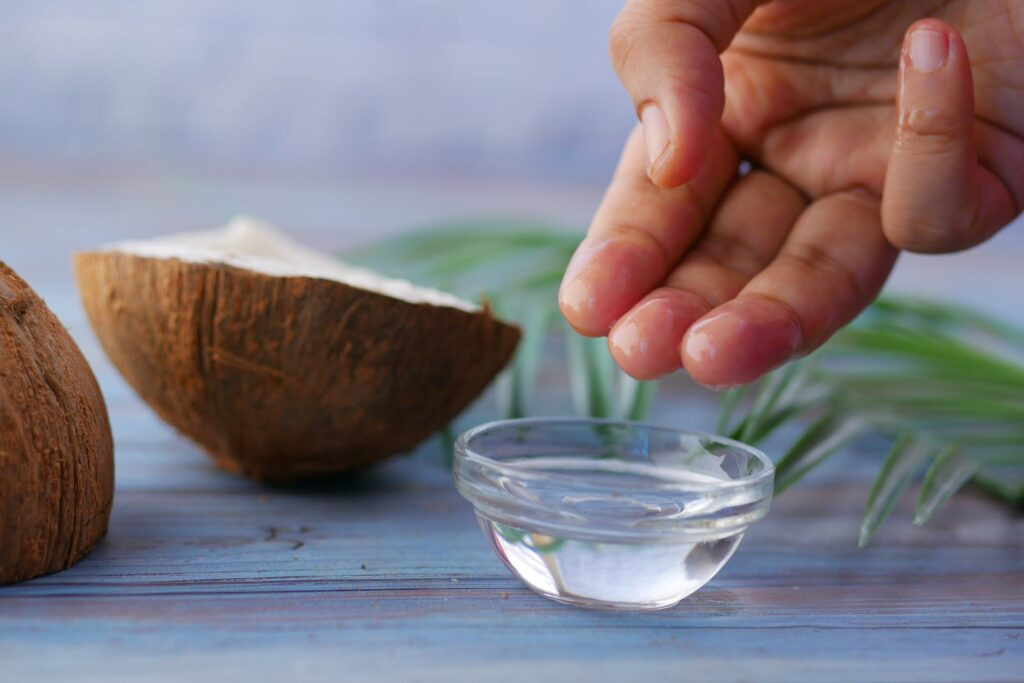 Applying Coconut Oil to Tattoo for Aftercare