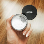 Orange color corrector used to cover a black tattoo