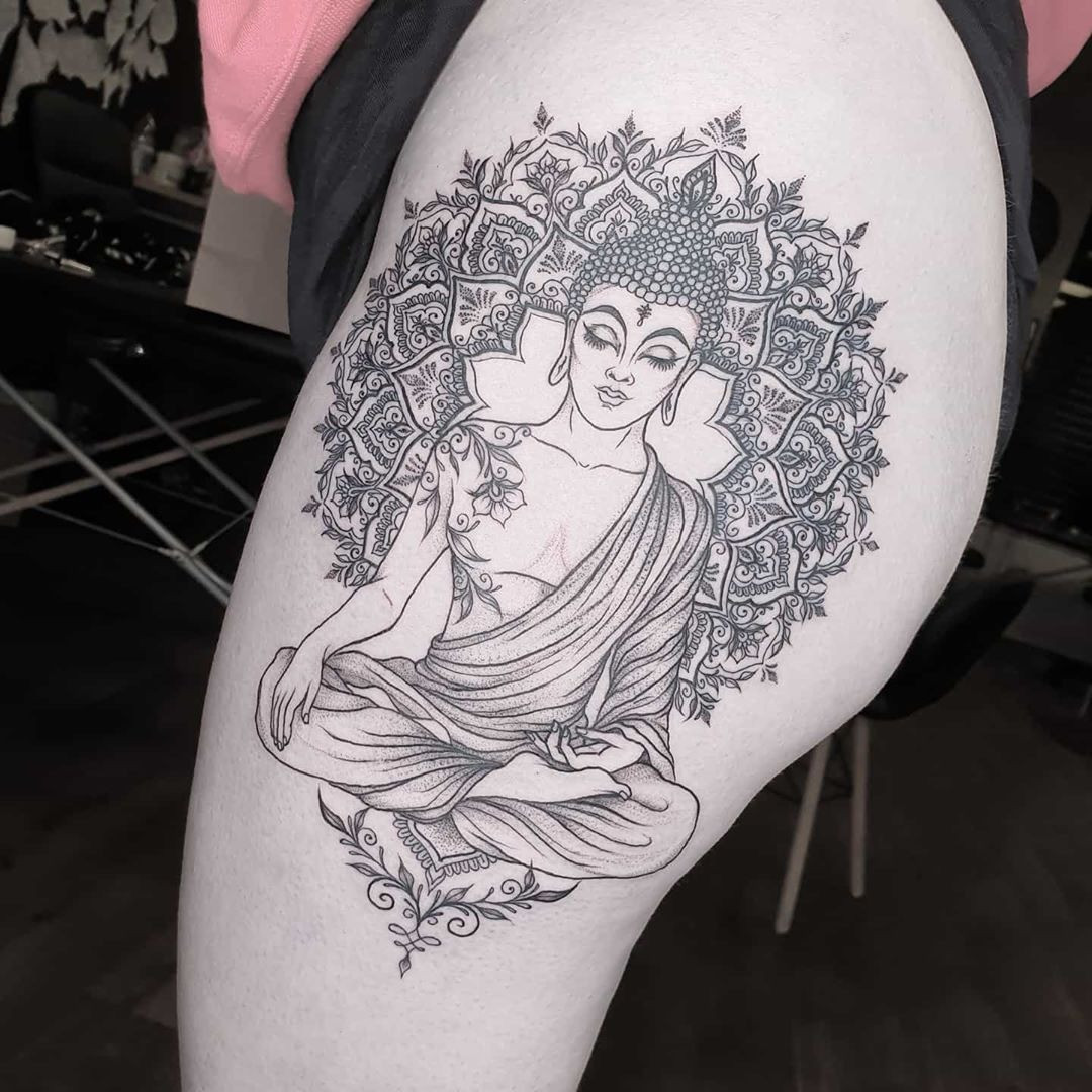 A Buddha mandala tattoo with intricate geometric patterns