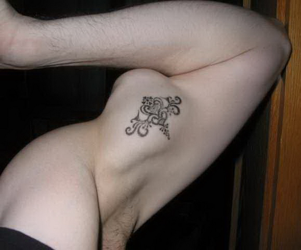design inner bicep tattoo for men, moisturize to prevent fading
