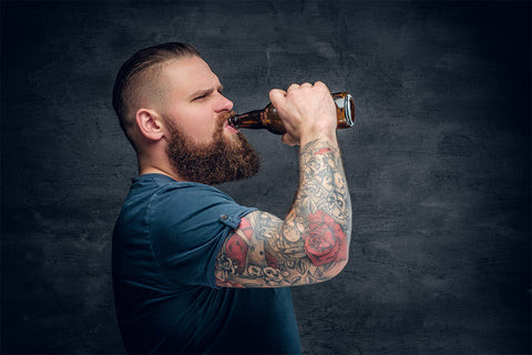 Before, during, and after your session, understand the connection between drinking and tattoos