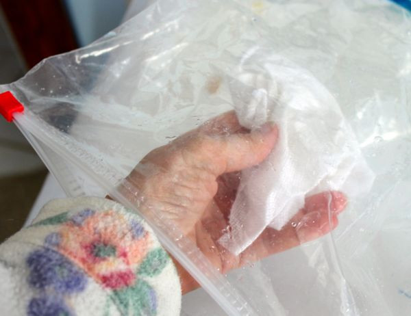 Fabric inside a ziploc bag during the dyeing process with tattoo ink