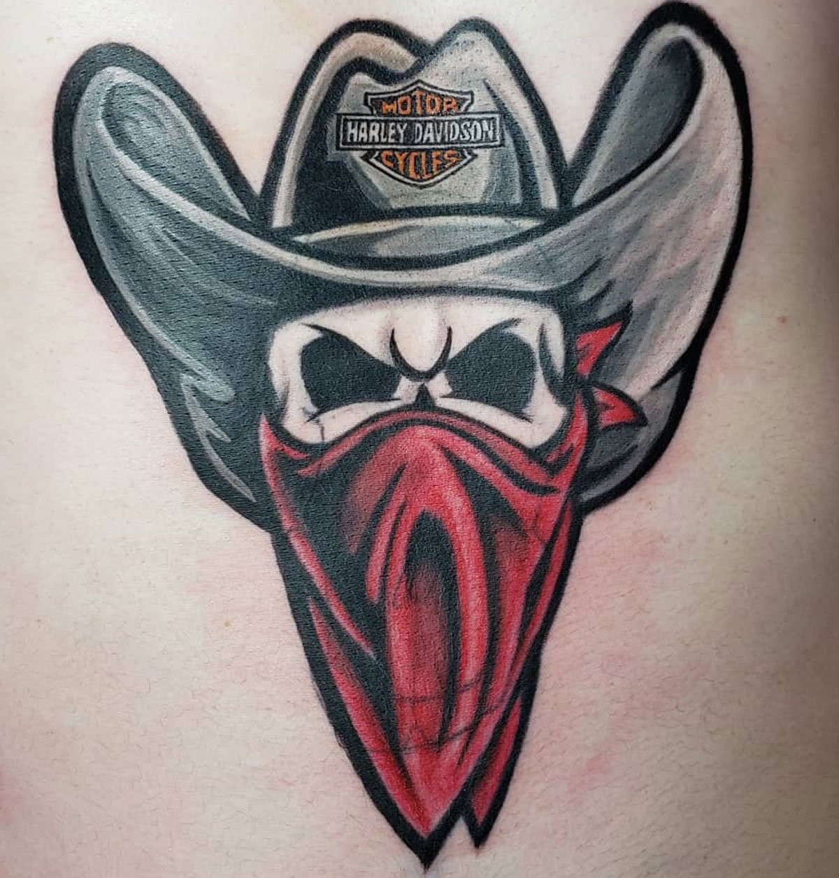 Tattoo artist at work, focusing on fine details
