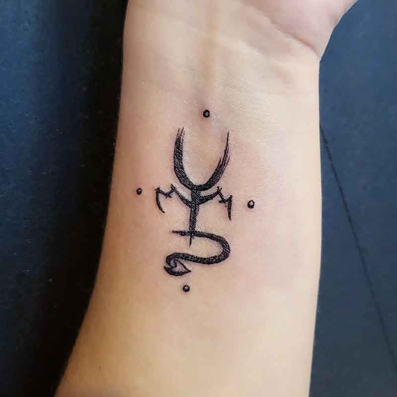 A sigil tattoo on the wrist, serving as a constant reminder of personal intentions