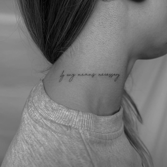 Feminine script tattoo on neck with elegant font