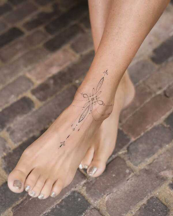 A delicate floral foot tattoo