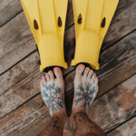 foot tattoo with leaves