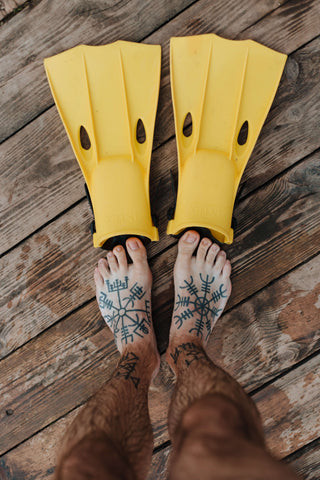 foot tattoo with leaves