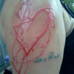 Scratcher tattoo on arm