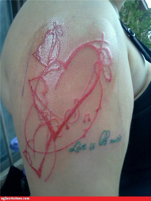 Funny tattoo on arm showing the limitations of tattooing oneself