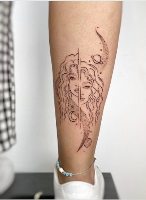 Stylized Gemini twins tattoo with geometric shapes on the shoulder