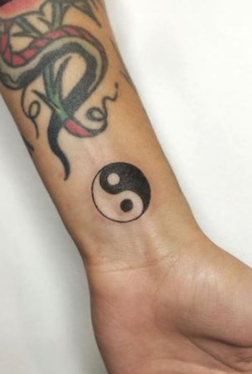 Minimalist Gemini twins tattoo with delicate lines on the wrist