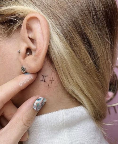 Fine line Gemini glyph tattoo on the wrist