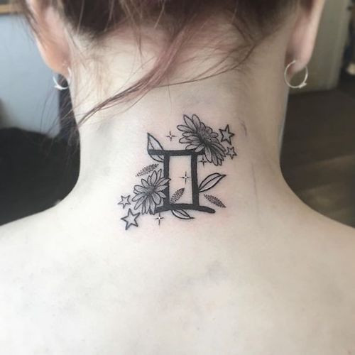 Gemini constellation tattoo with lavender accents on the wrist