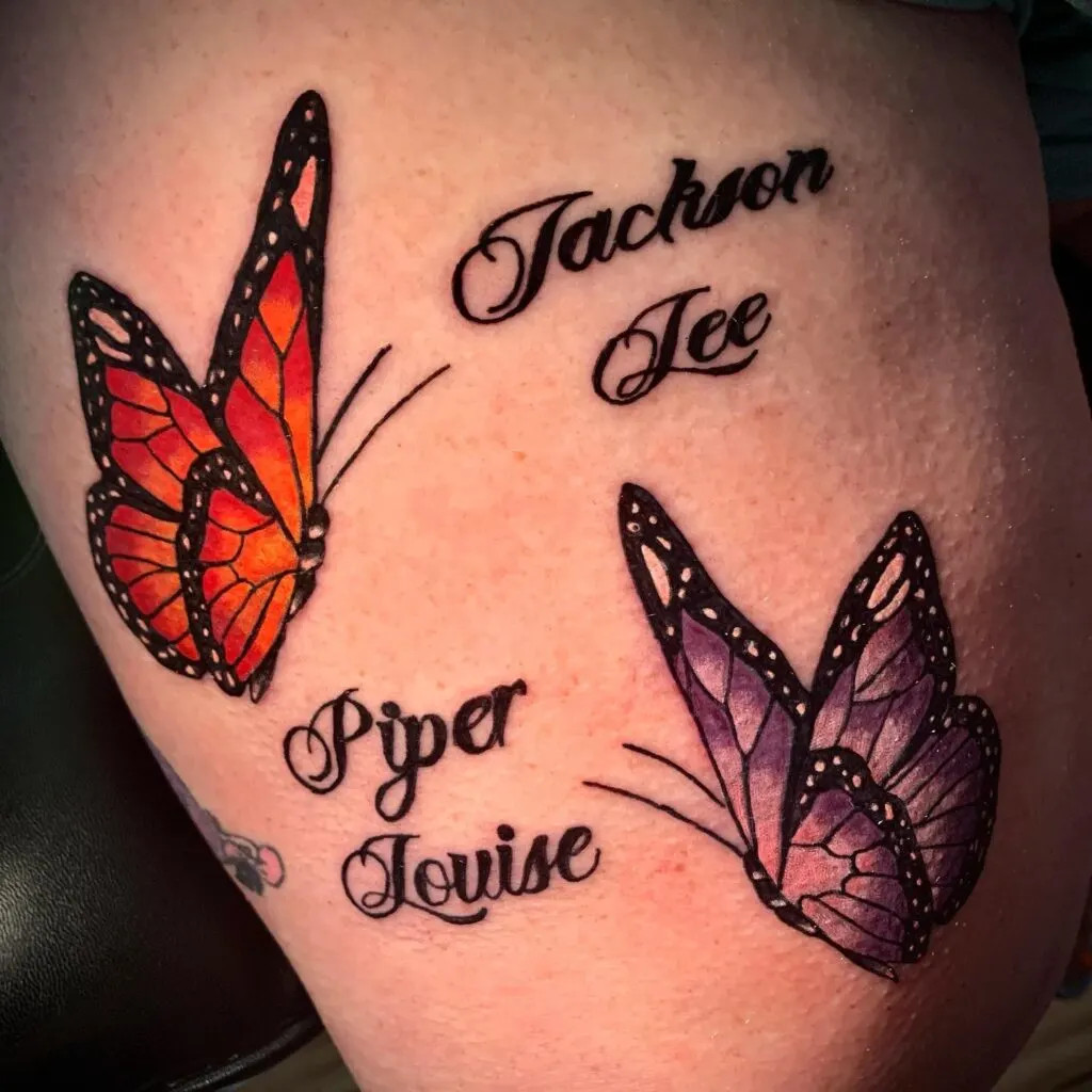 Butterflies with grandchildren's names tattoo, symbolizing transformation and beauty with vibrant colors and elegant script